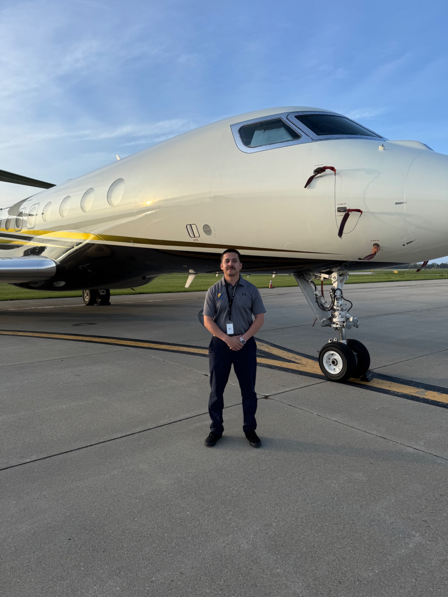 Enrique Gonzalez standing next to a large business jet